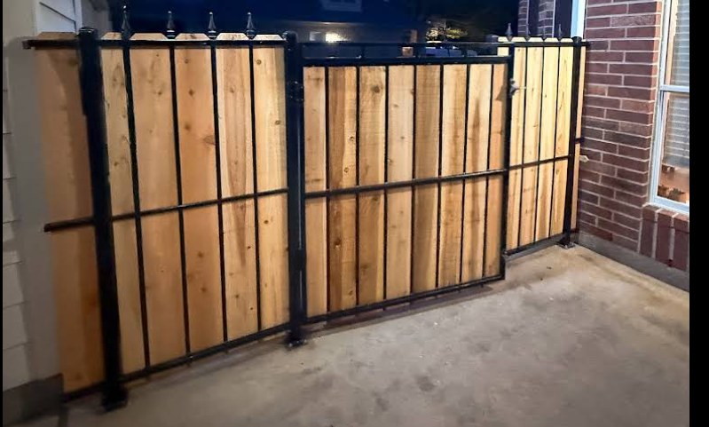 Custom horizontal cedar fence on black steel frame — Gomez Fencing